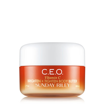 C.E.O. Vitamin C Brighten + Tighten Body Butter by Sunday Riley in its 200 mL jar, featuring an orange and white gradient design with bold white lettering.